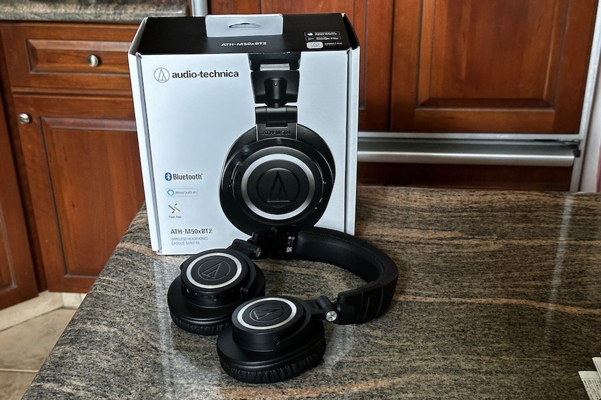 a photo of audio-technica ATH-M50xBT2 Wireless Headphones and box on a countertop