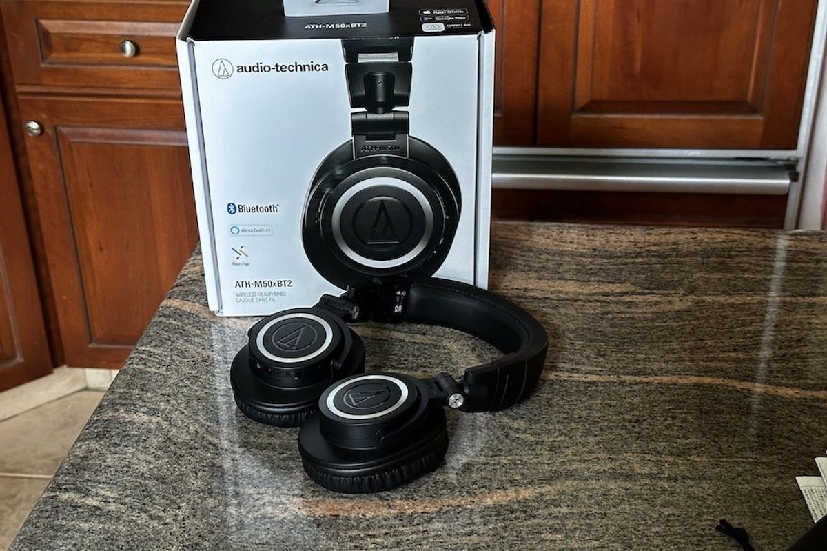 a photo of audio-technica ATH-M50xBT2 Wireless Headphones and box on a countertop