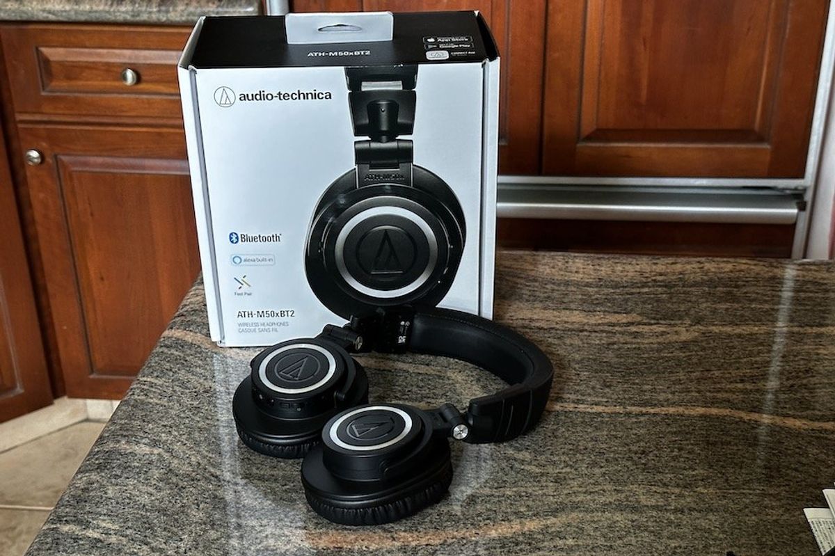 a photo of audio-technica ATH-M50xBT2 Wireless Headphones and box on a countertop