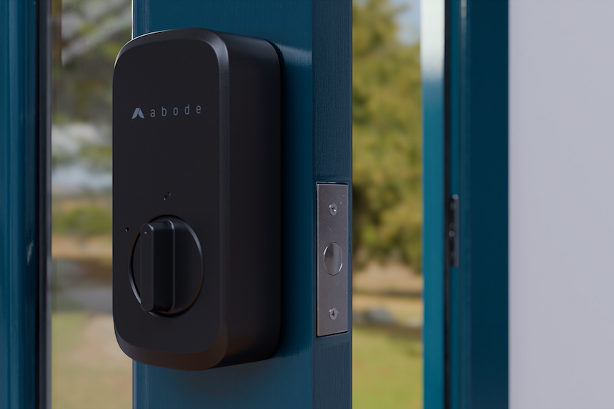 a photo of a door with Abode Retrofit Smart Lock install on it.