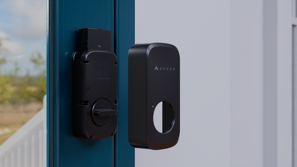a photo of Abode smart lock on a door showing casing
