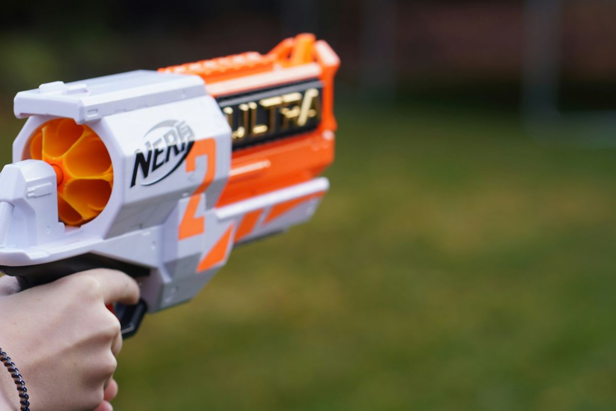 person holding a nerf gun