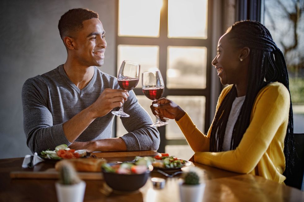 Happy-black-couple-toasting-during-an-intimate-date
