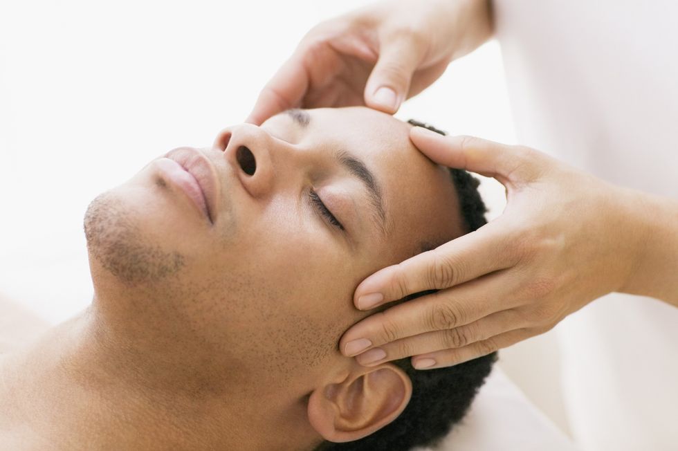 Close-up-of-man-enjoying-head-massage