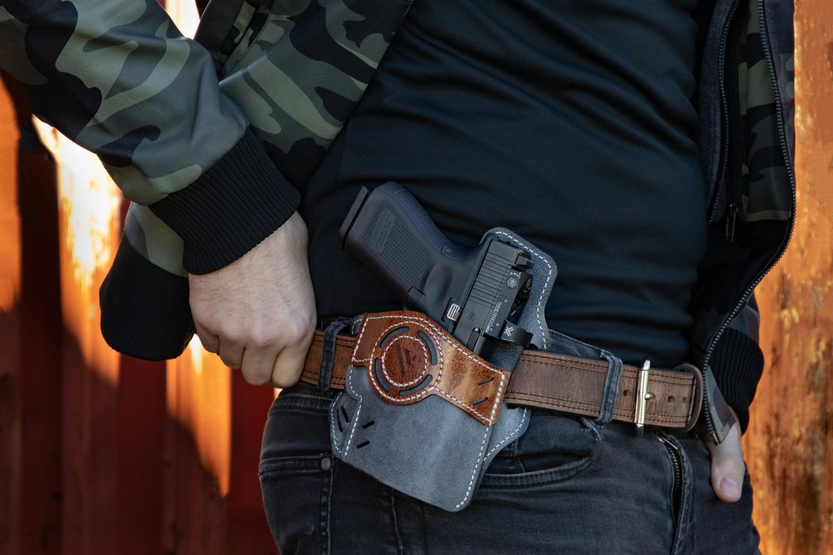 man with a handgun in a hip holster