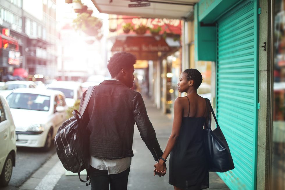 Couple-walking-on-the-sidewalk-holding-hands