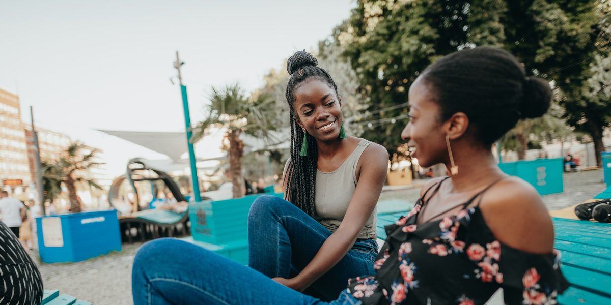 Black-women-talking-together-in-park