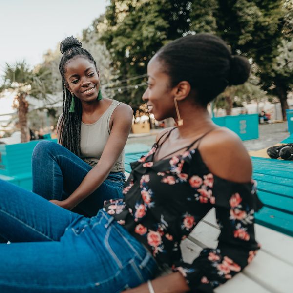 Black-women-talking-together-in-park