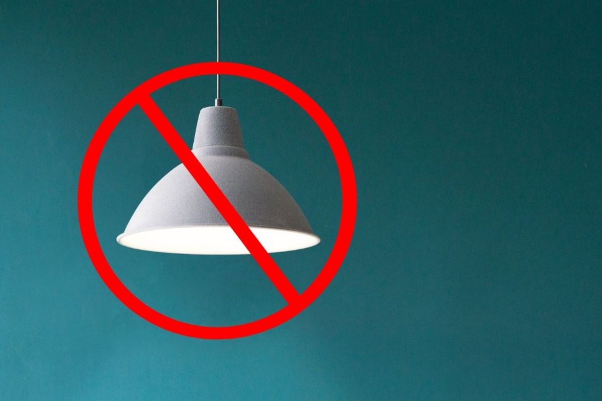 ceiling light with a red cross through it