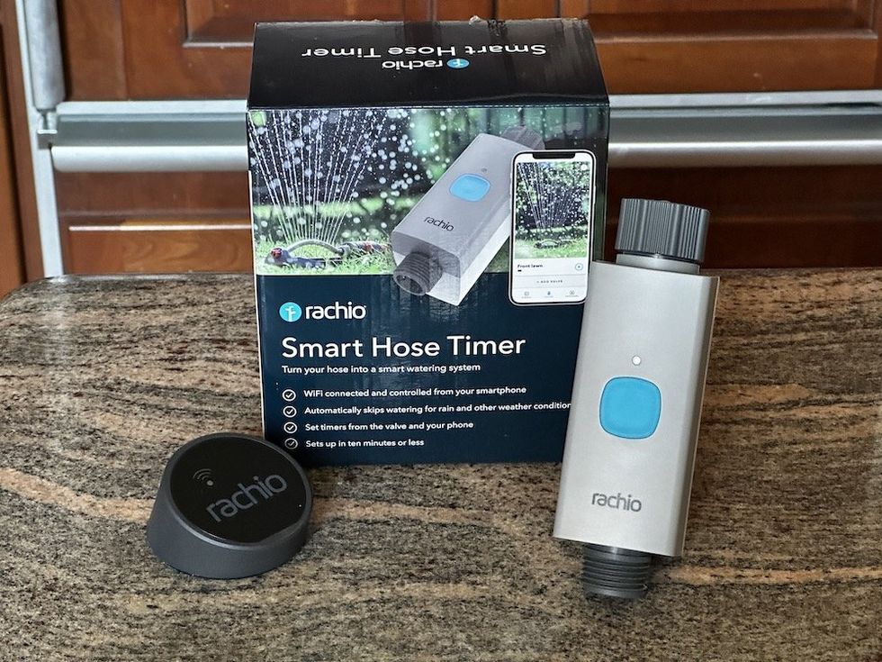 a photo of Rachio Smart Hose Timer and box on a counter