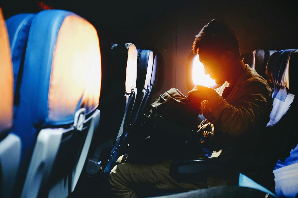 man sitting on an airplane