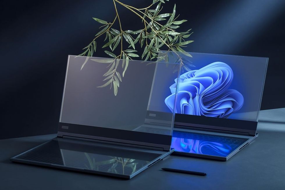 a photo of Lenovo Transparent Display Laptop on a desk with another Lenovo Transparent Display Laptop.