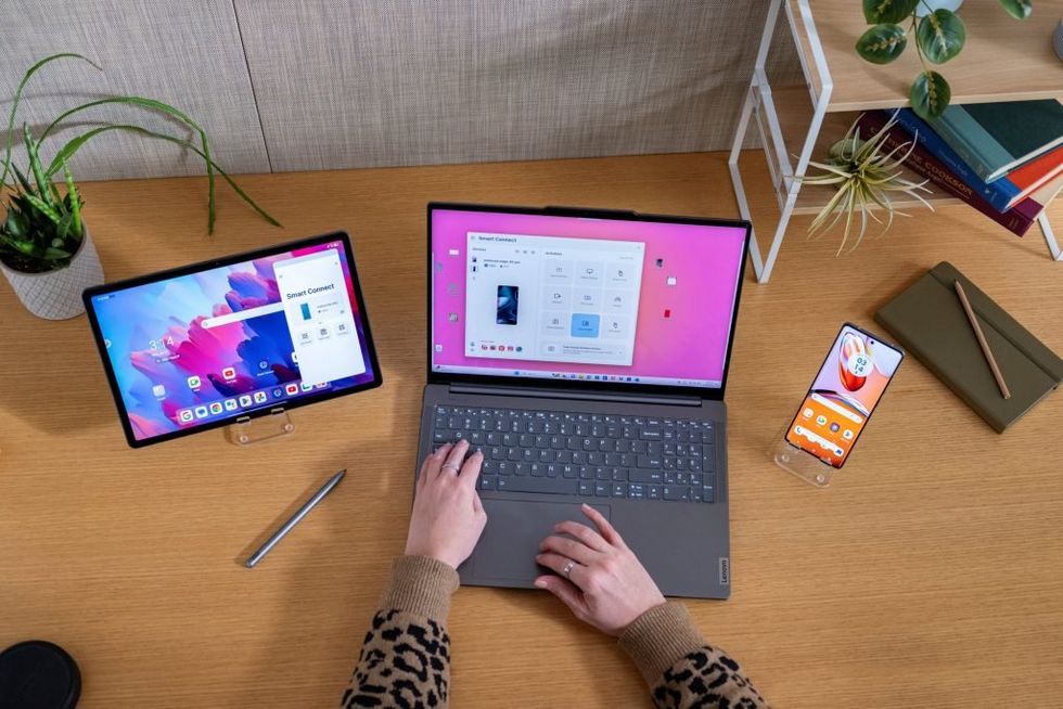 a photo of a laptop, tablet and smartphone working together as one with Smart Connect by Motorola and Lenovo.