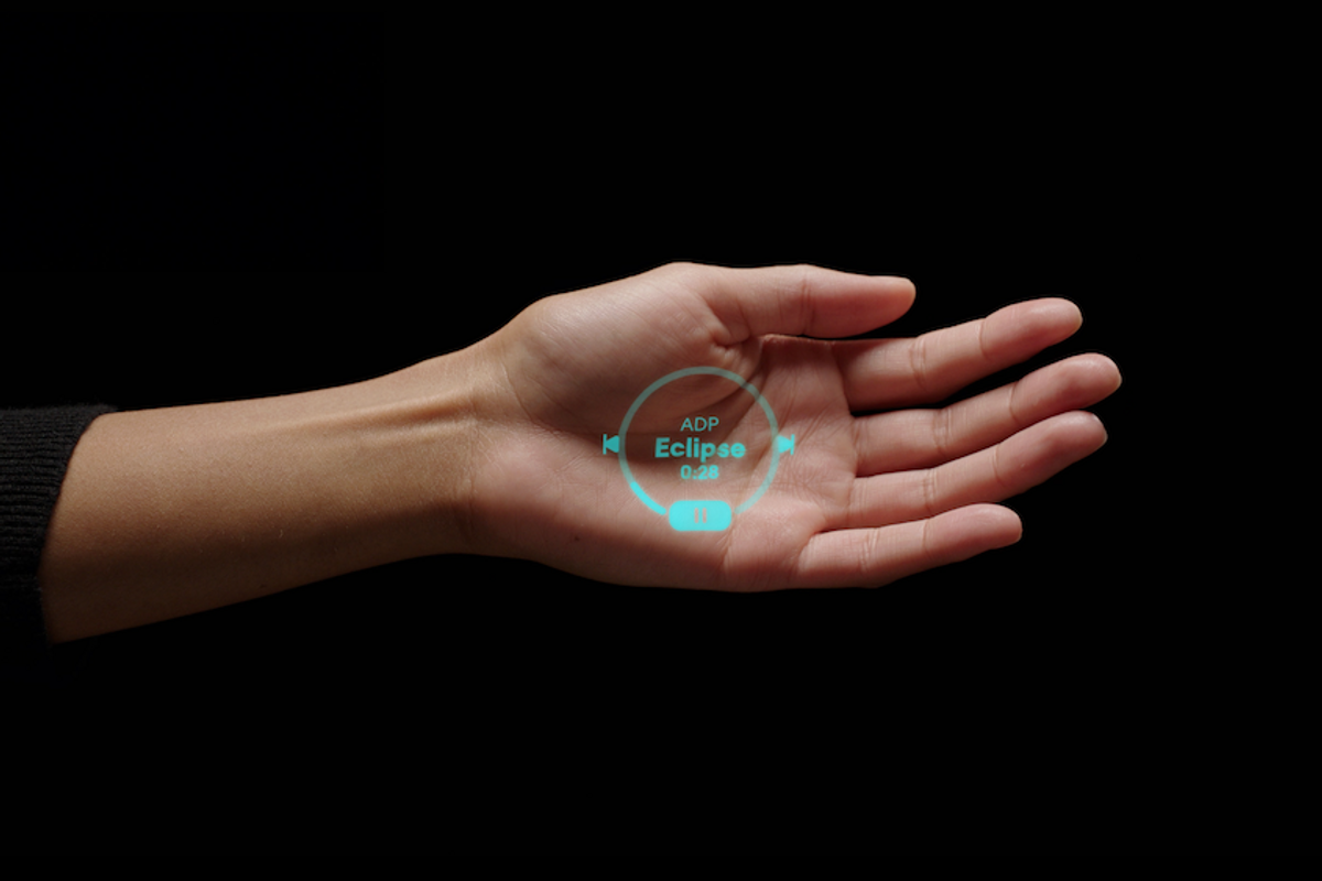 a photo of a woman's hand showing a message from humane ai pin