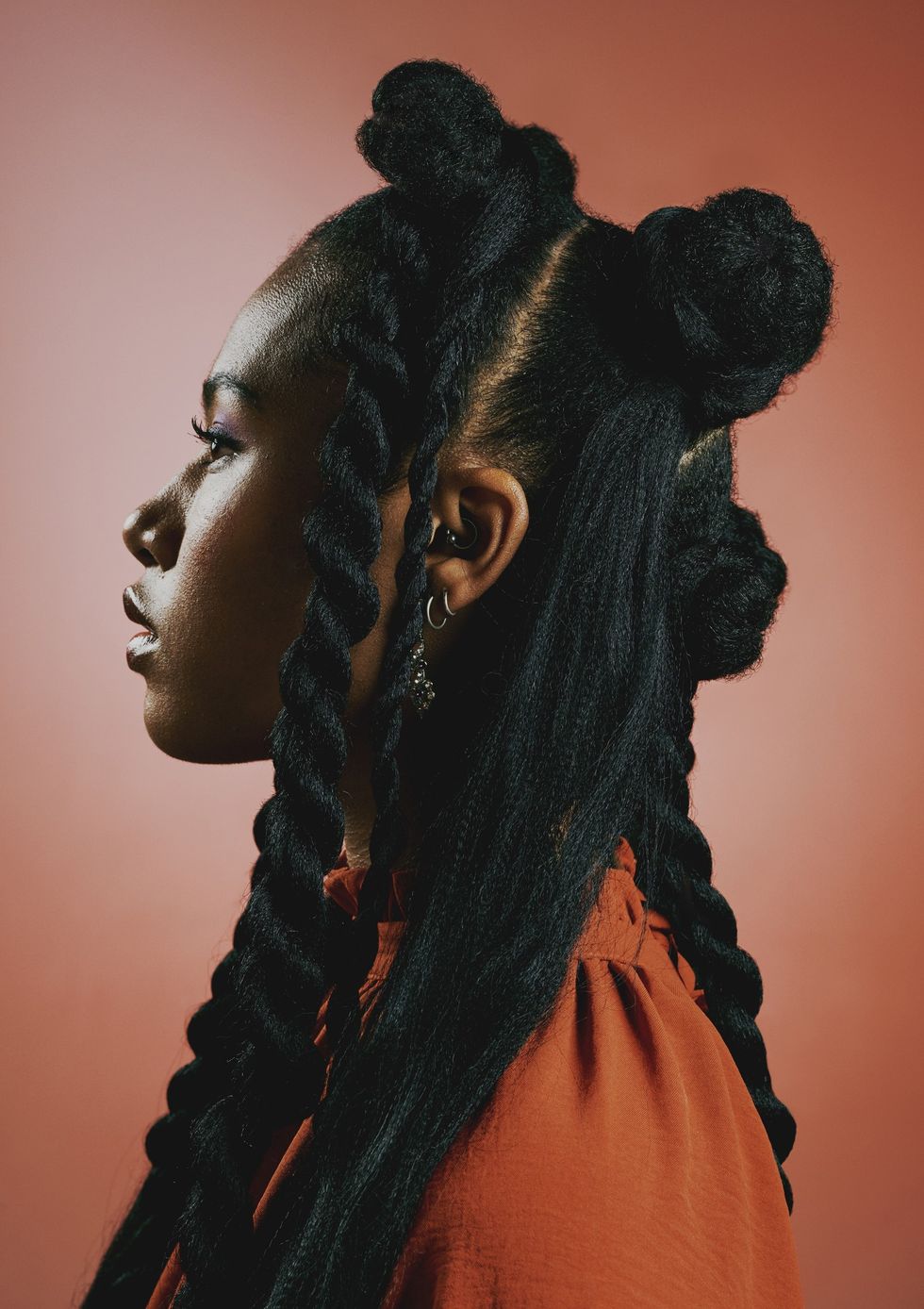 Side-profile-of-Black-women-wearing-edgy-trendy-braided-hairstyle