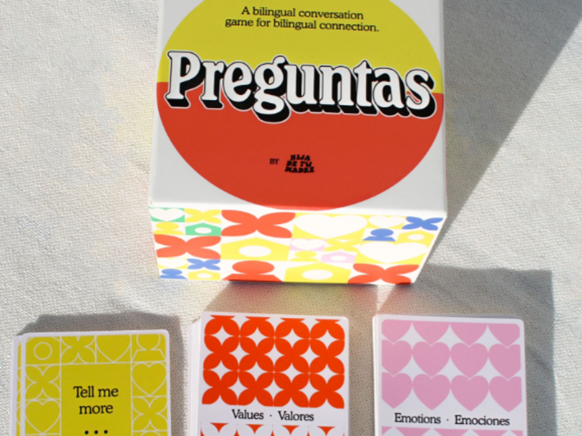 a promotional image for the latino cards game Preguntas: Bilingual Conversation