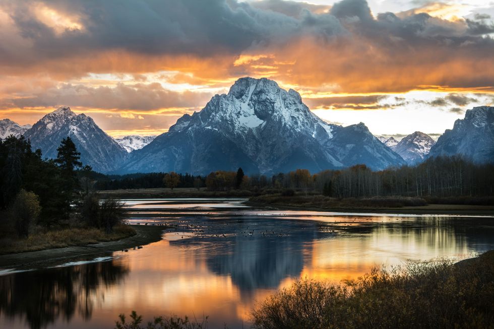 Mountains rising up behind a lake at sunset