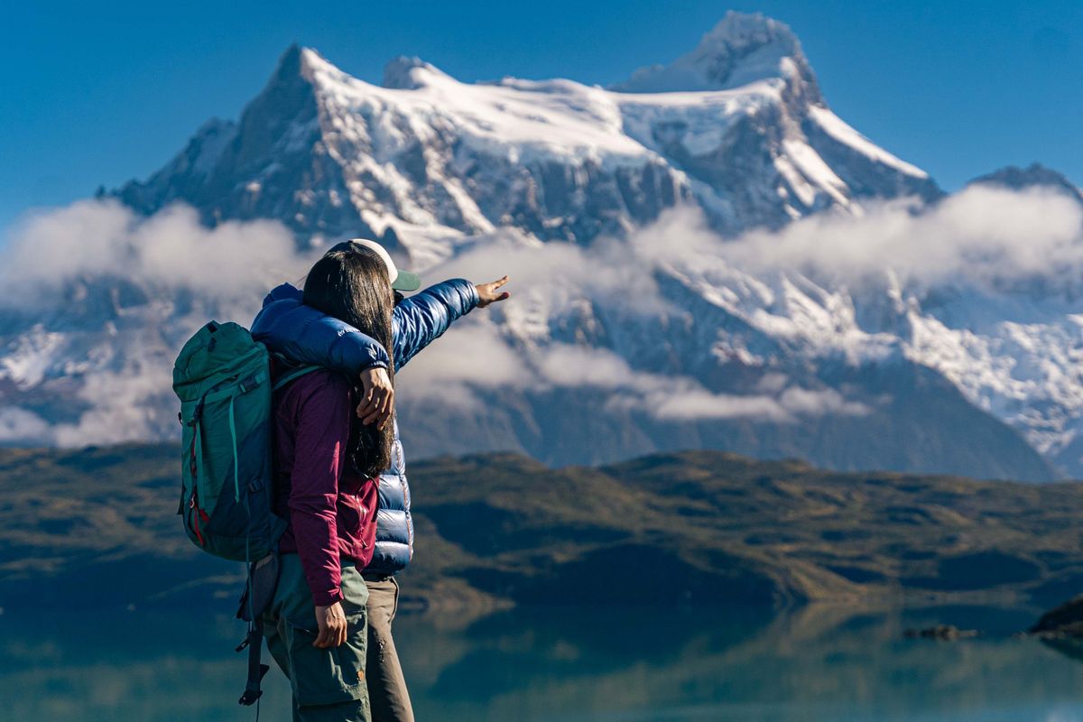 couple looking at a snow capped mountain