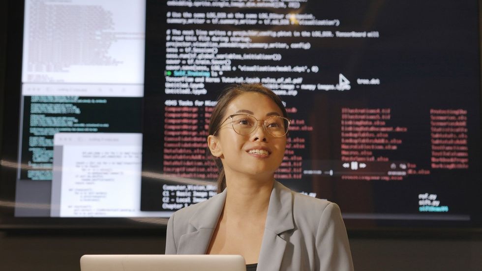 a photo of a woman at a Coding seminar