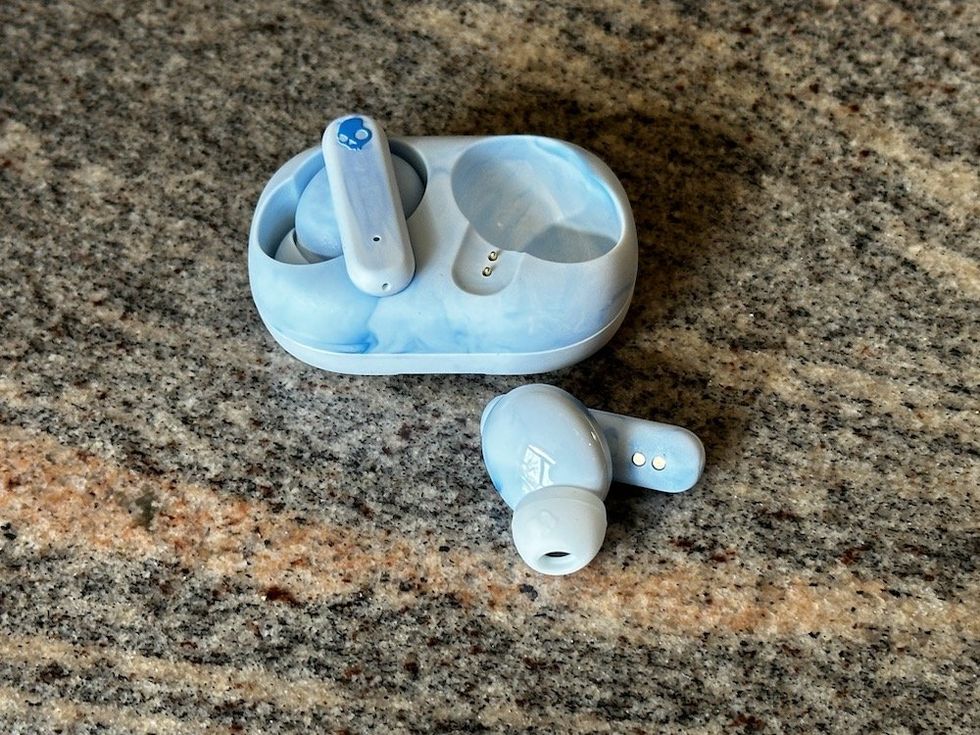 a photo of Skullcandy Ecobuds case and earbuds on a countertop