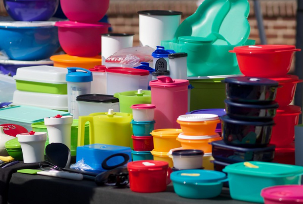 photograph of a table full of tupperware containers
