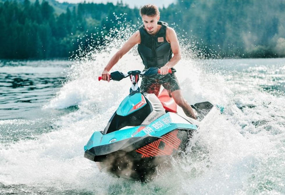 man riding on a jet ski