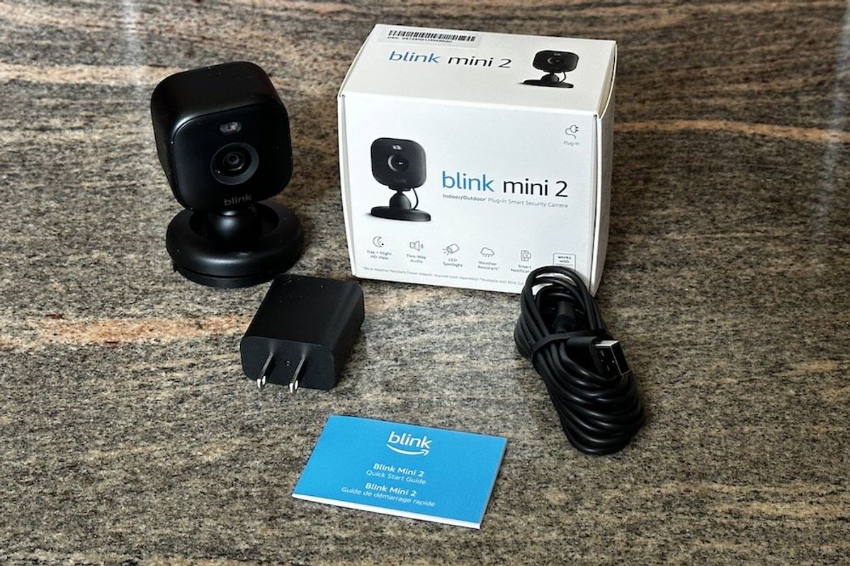 a photo of Blink Mini 2 Indoor/Outdoor Plug-in Smart Security Camera unboxed