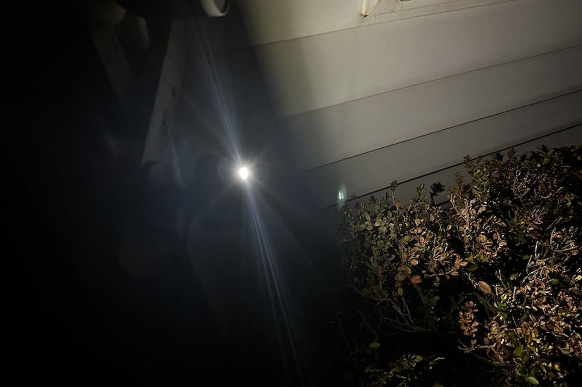 a photo of Blink Mini 2 Camera outside with LED on