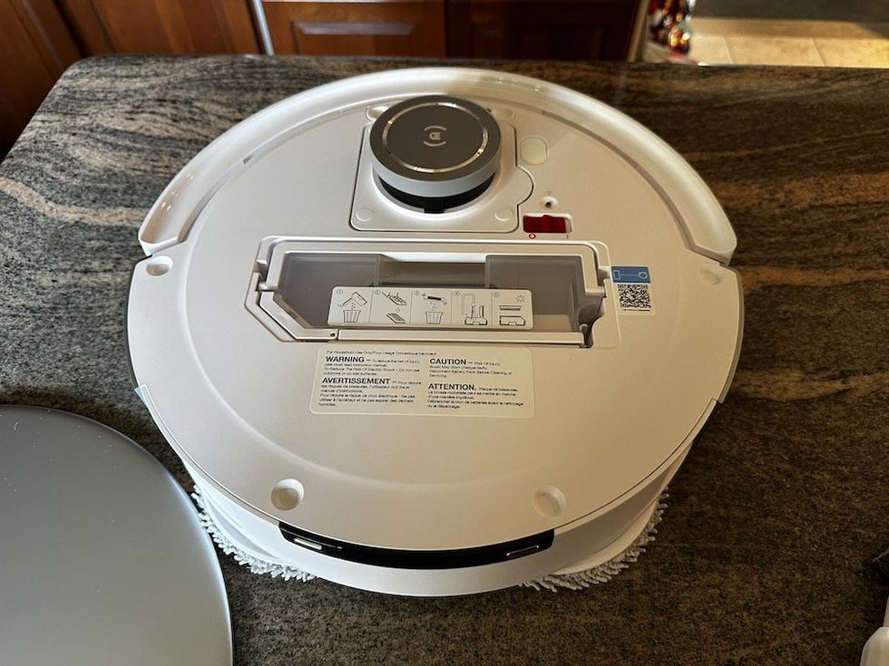 a photo of the top of the DEEBOT T20 OMNI robot vacuum without its cover on.