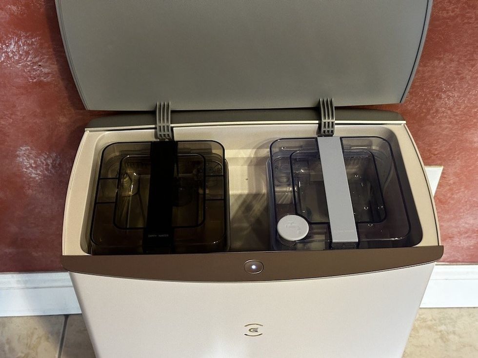 a photo of the DEEBOT T20 OMNI robot vacuum's water tanks installed in the Omni Station.