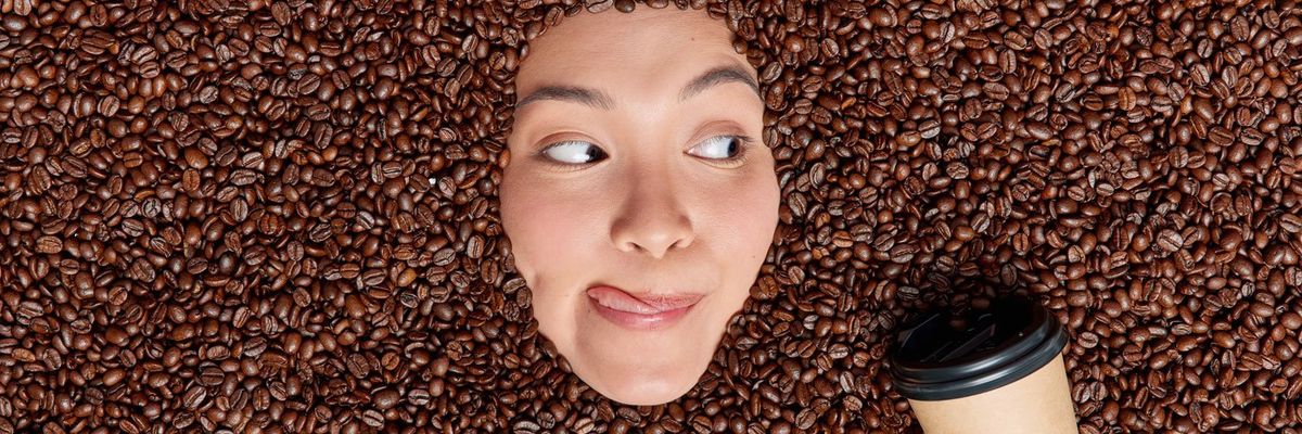 Graphic design showing a woman immersed in coffee beans