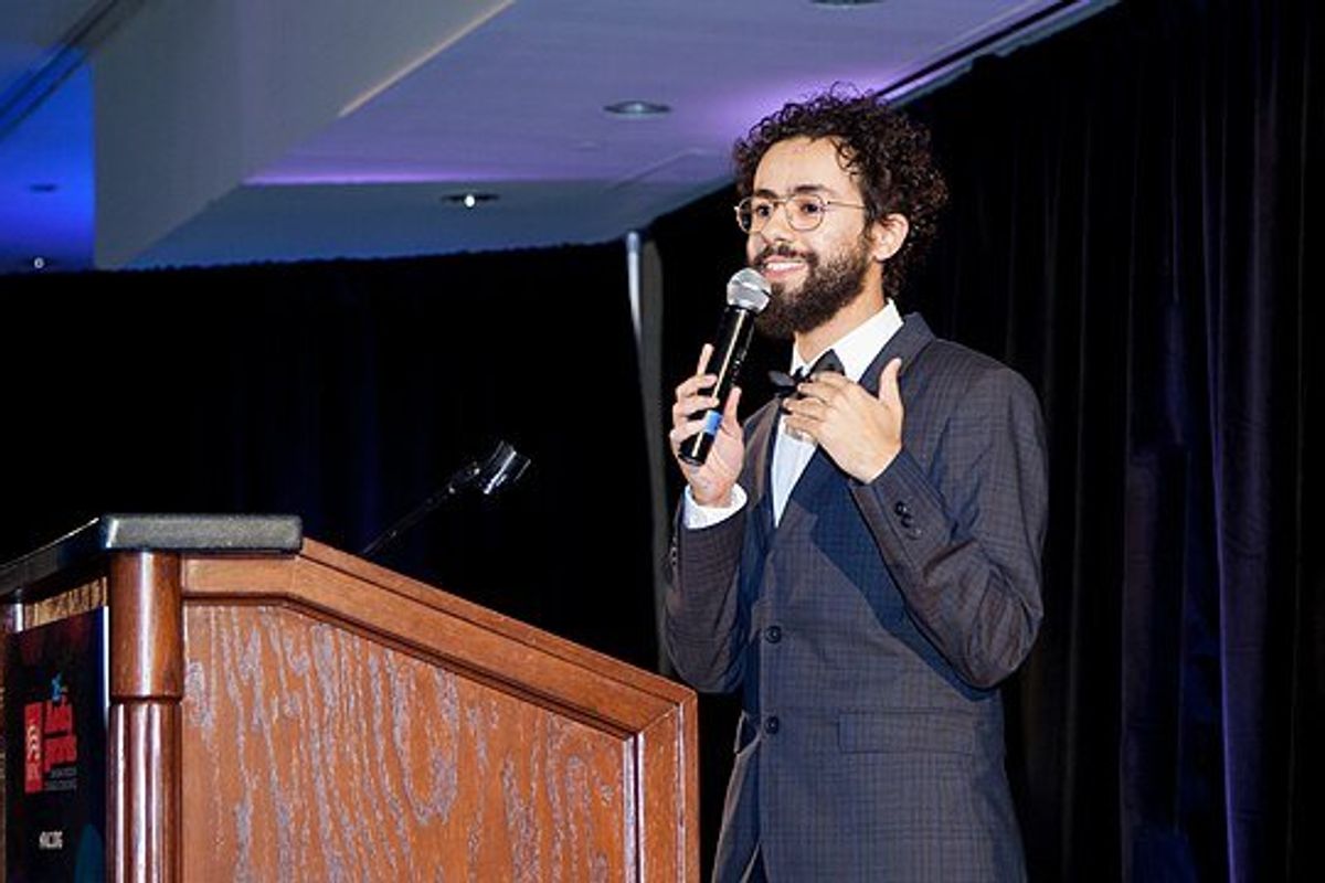 Ramy Youssef at a podium