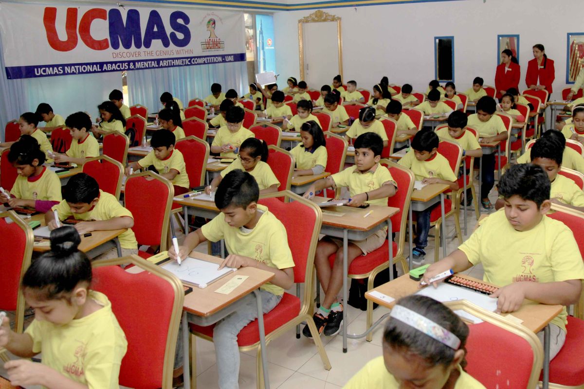 kids in desks at a math competition