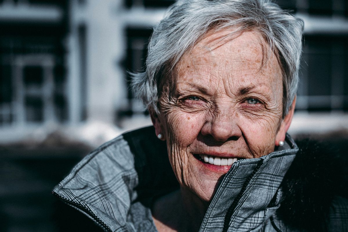 older woman smiling at the camera