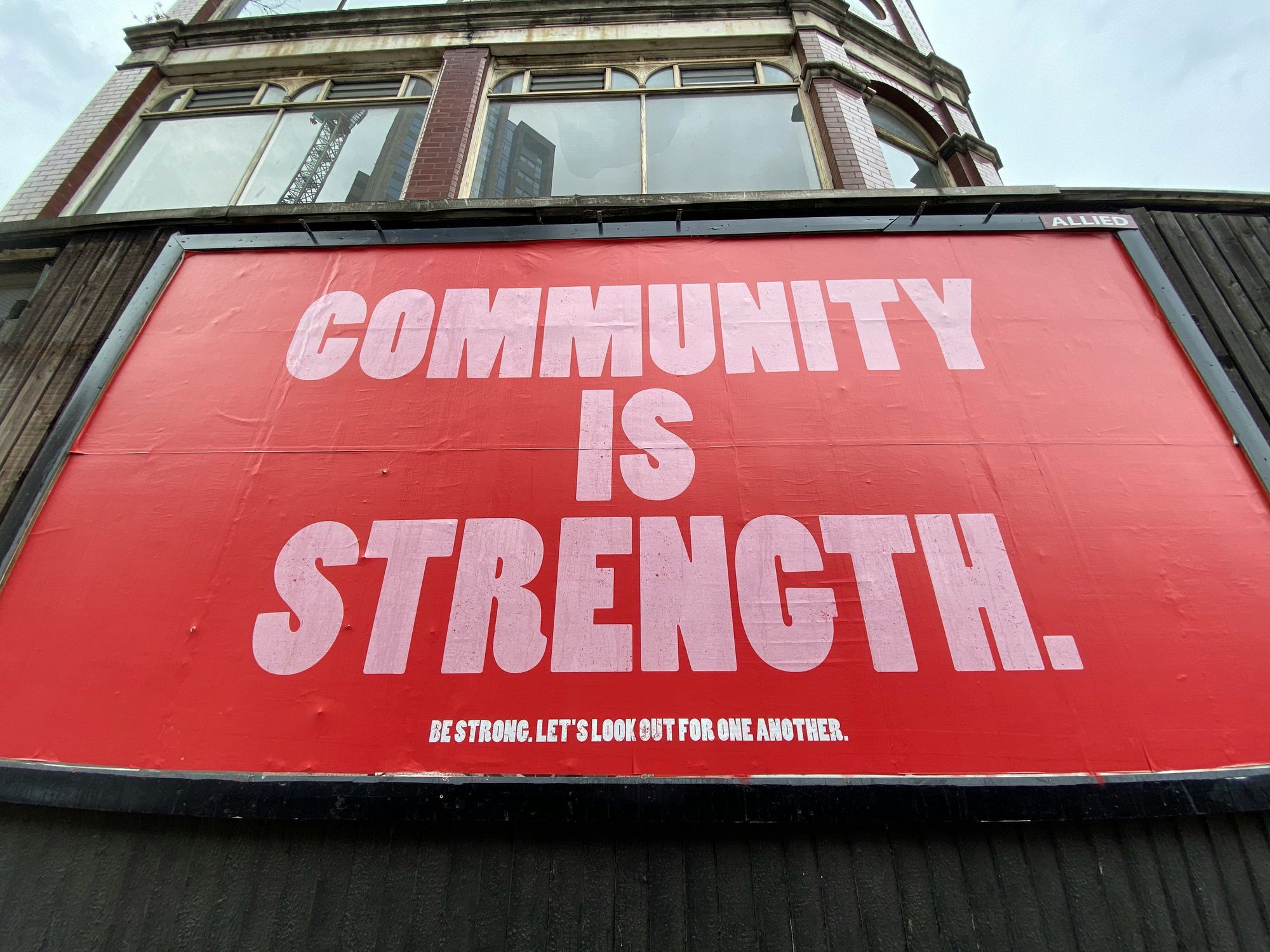 Poster with the phrase "Community is strength."