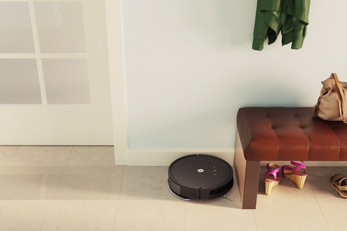 a photo of Roomba Combo Essential vacuum in a entryway