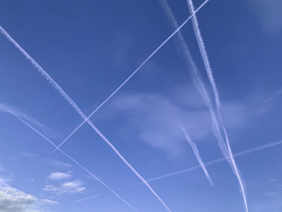 contrails criss crossing in the sky