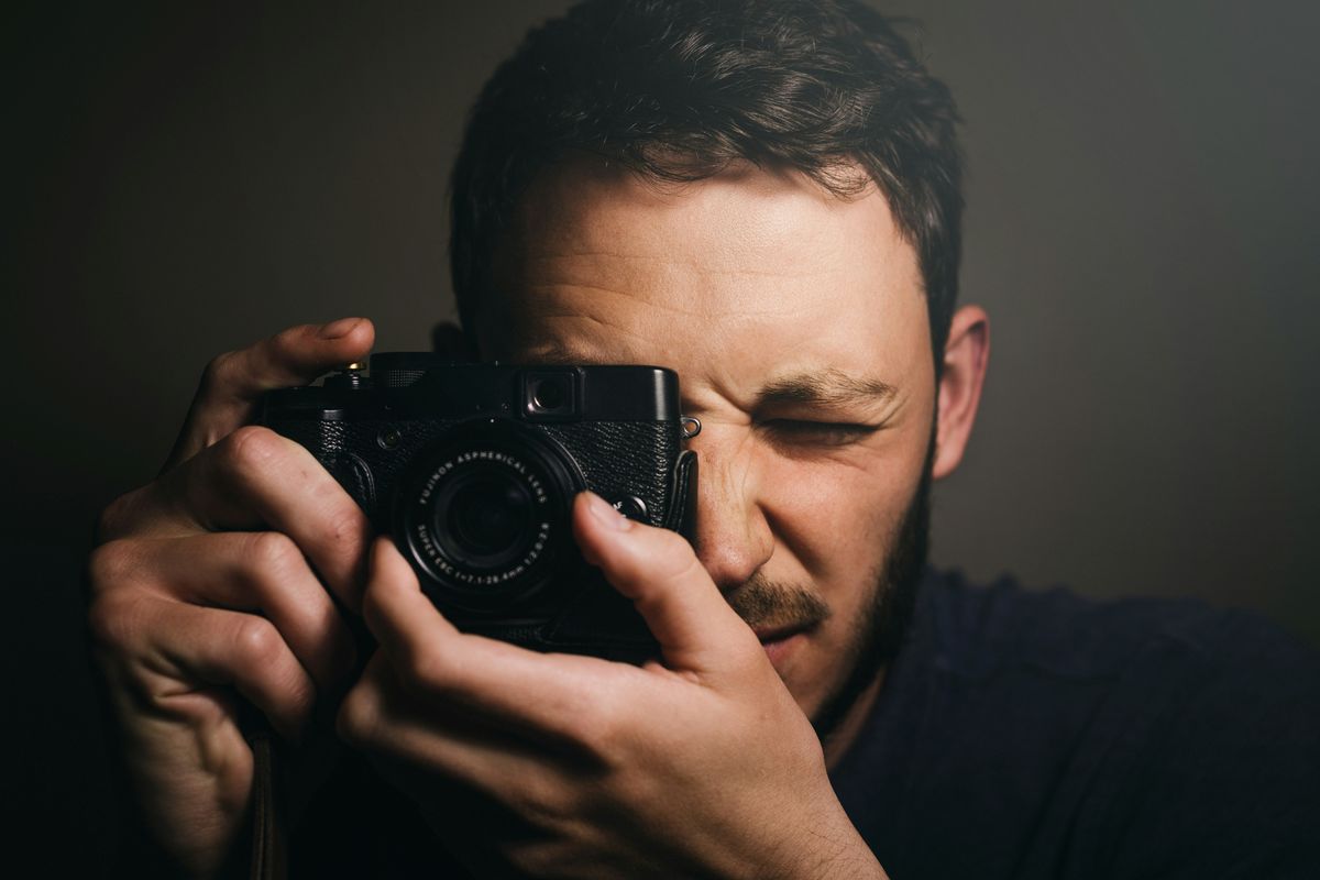 man taking a photo with a camera