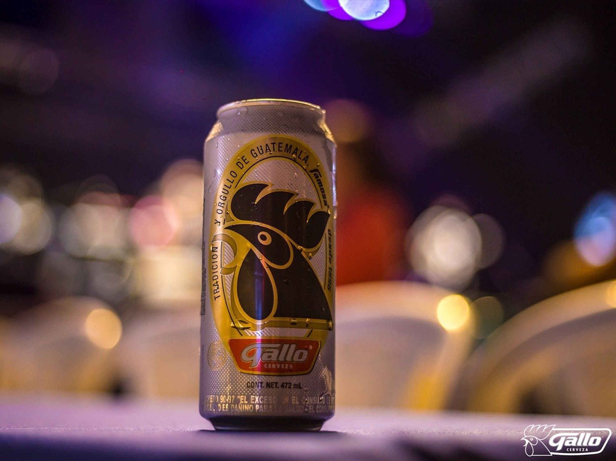A can of 'Gallo,' the Guatemalan beer, rests on a bar table.