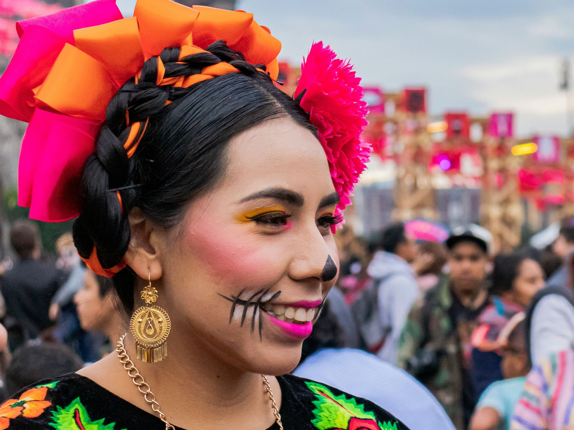 smiling woman in a traditional Mexican costume