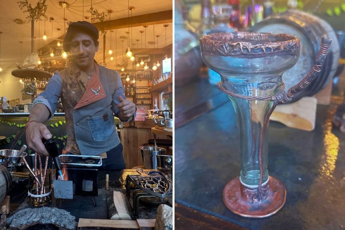 bartender creating cocktail, glass made of reused bottle and copper