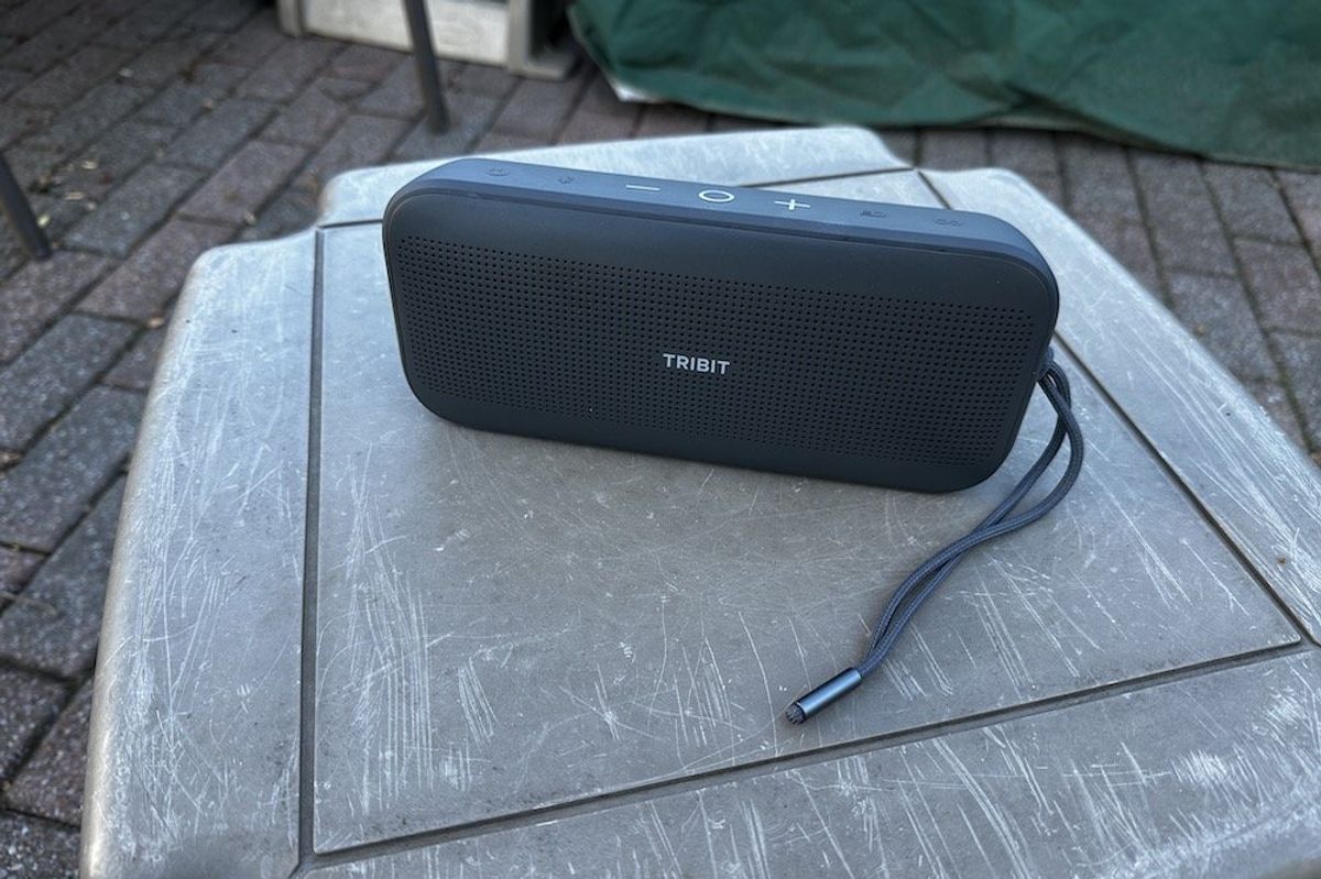 a photo of Tribit StormBox Flow Portable Wireless Speaker outside on a table.
