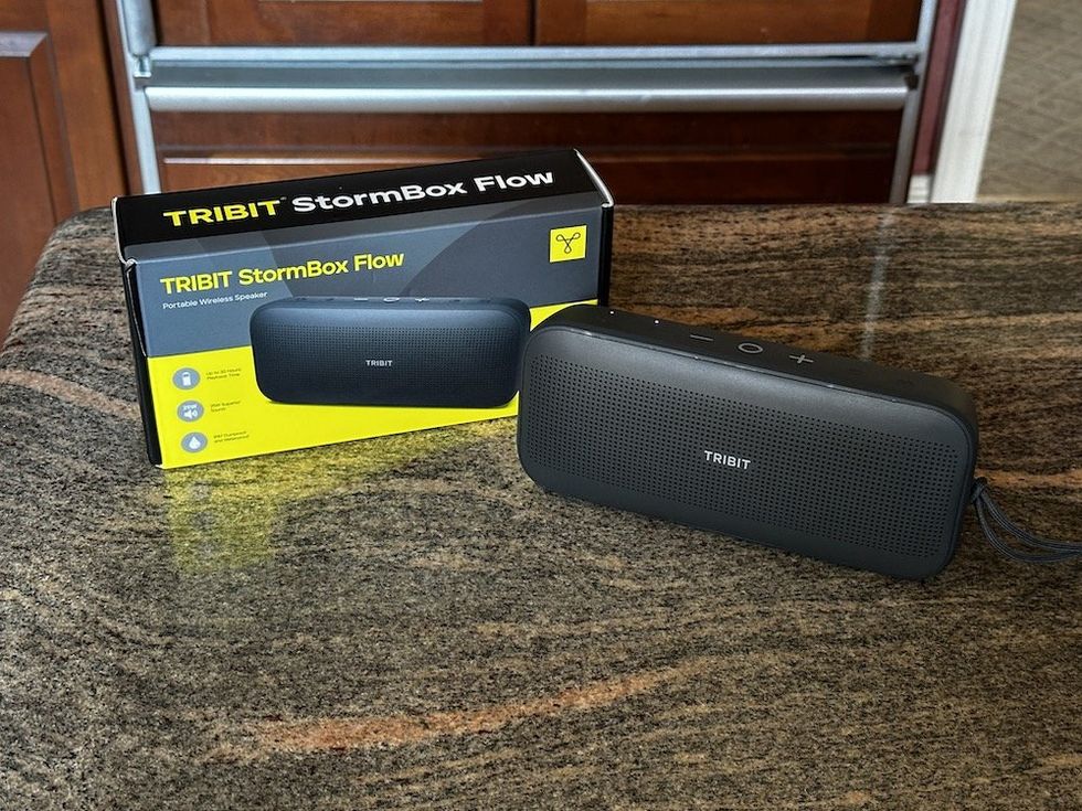 a photo of Tribit StormBox Flow Portable Wireless Speaker and box on a counter.
