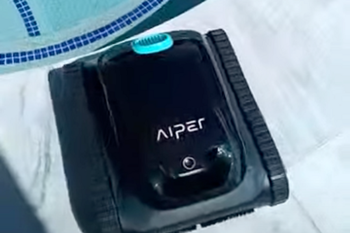 a photo of Aiper Scuba S1 Cordless Robotic Pool Cleaner on a pool deck