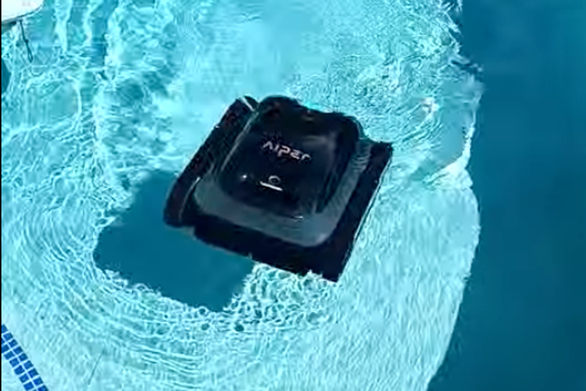 a photo of Aiper Scuba S1 Cordless Robotic Pool Cleaner submerging in a pool