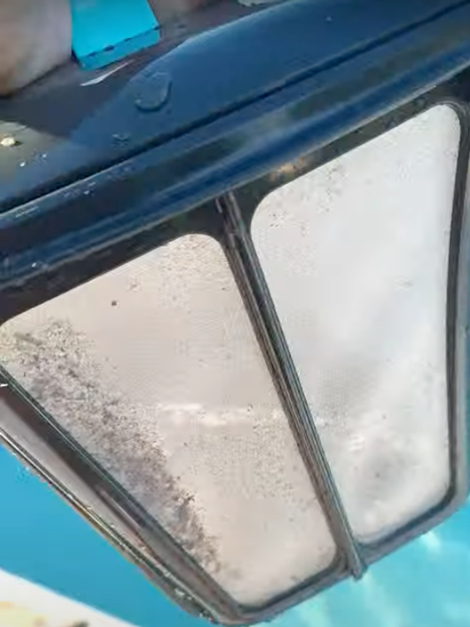 a photo of the waste basket of Aiper Scuba S1 Cordless Robotic Pool Cleaner showing the particles it picked up in the water