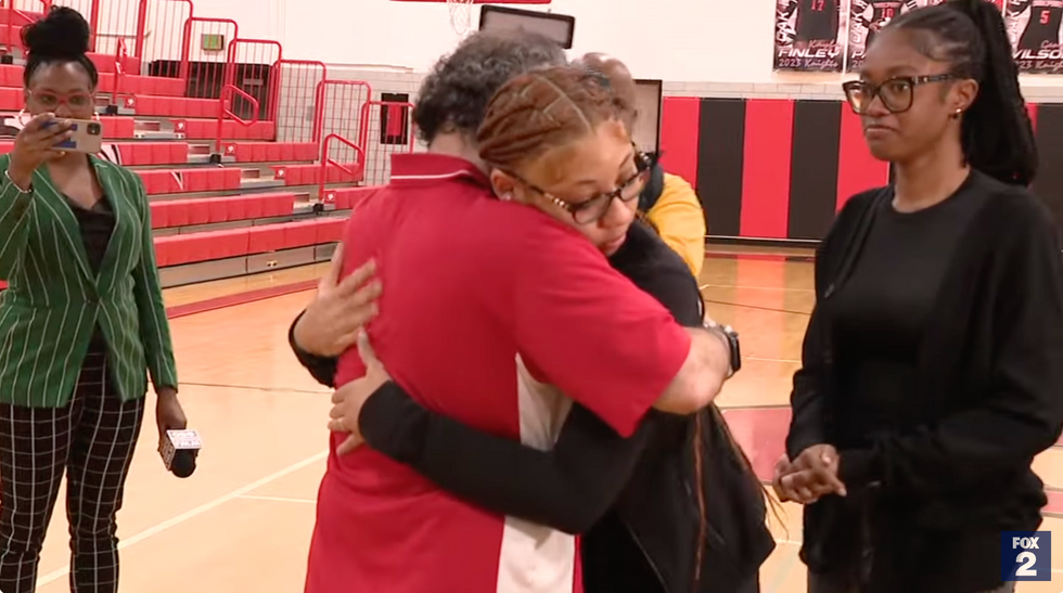 Two high school students saved a teacher's life after he went into cardiac arrest