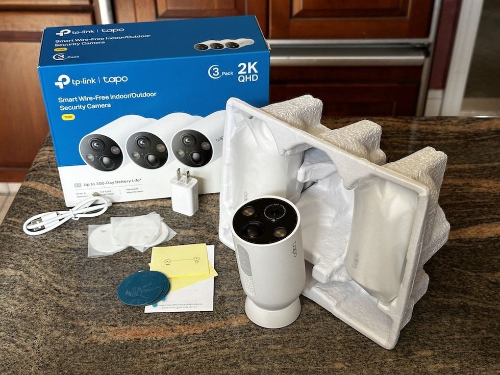 a photo of TP-Link Tapo Smart Wire-Free Indoor/Outdoor Security Camera 3-Pack unboxed