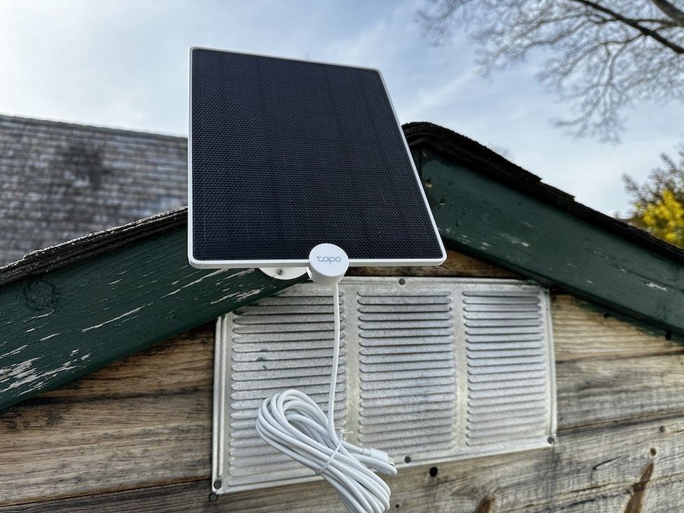 a photo of TP-Link Tapo Solar Panel A200 installed on a shed