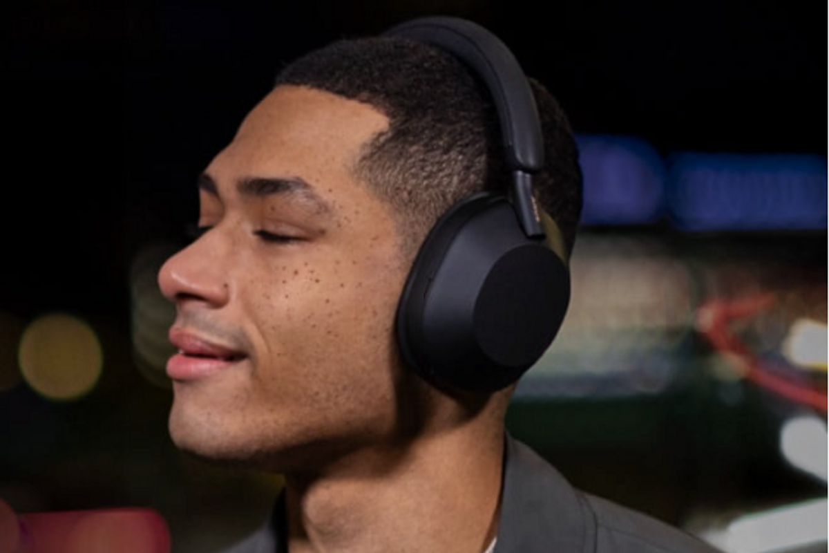 a photo of a male wearing Sony WH-1000XN5 headphones